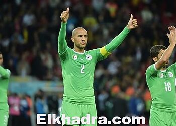 Algeria's defender and captain Madjid Bougherra (C) and Algeria's forward Abdelmoumene Djabou (R) gesture to the crowd after losing their Round of 16 football match against Germany following extra-time at Beira-Rio Stadium in Porto Alegre during the 2014 FIFA World Cup on June 30, 2014. AFP PHOTO / GABRIEL BOUYS        (Photo credit should read GABRIEL BOUYS/AFP/Getty Images)
