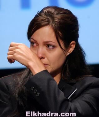 WASHINGTON - JUNE 20: Actress Angelina Jolie, Goodwill Ambassador for the United Nations High Commission for Refugees (UNHCR), cries during a World Refugee Day ceremony June 20, 2003 in Washington, DC. World Refugee Day celebrates the lives of the eight million refugee youths who live around the world.   Stefan Zaklin/Getty Images/AFP
